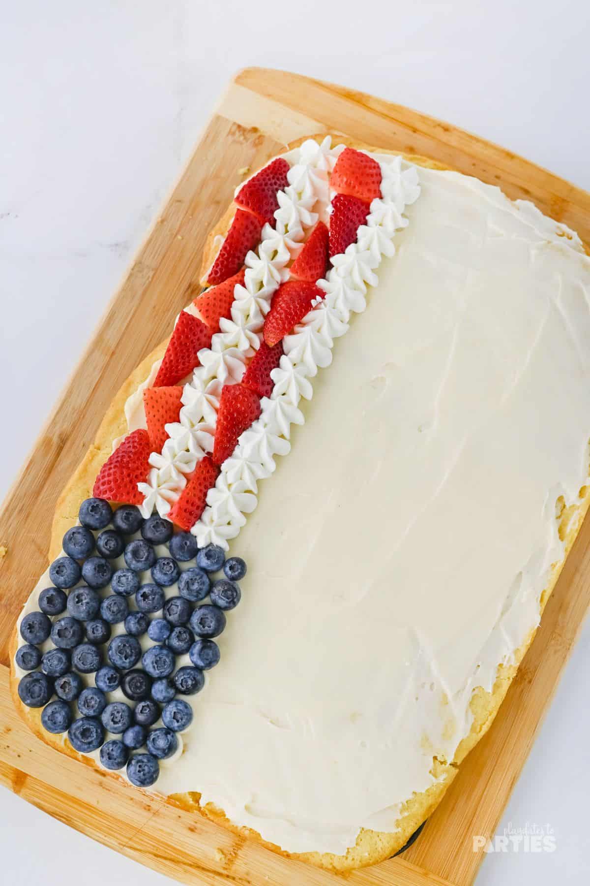 Getting started with making the stripes in the flag fruit pizza.