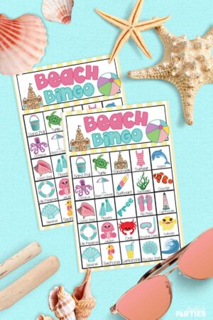 Two Beach Bingo cards surrounded by seashells.