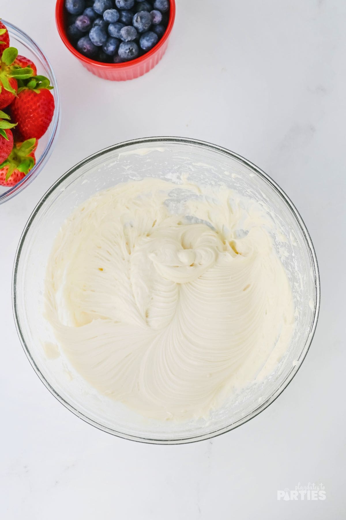 Whipped cream cheese frosting in a bowl.