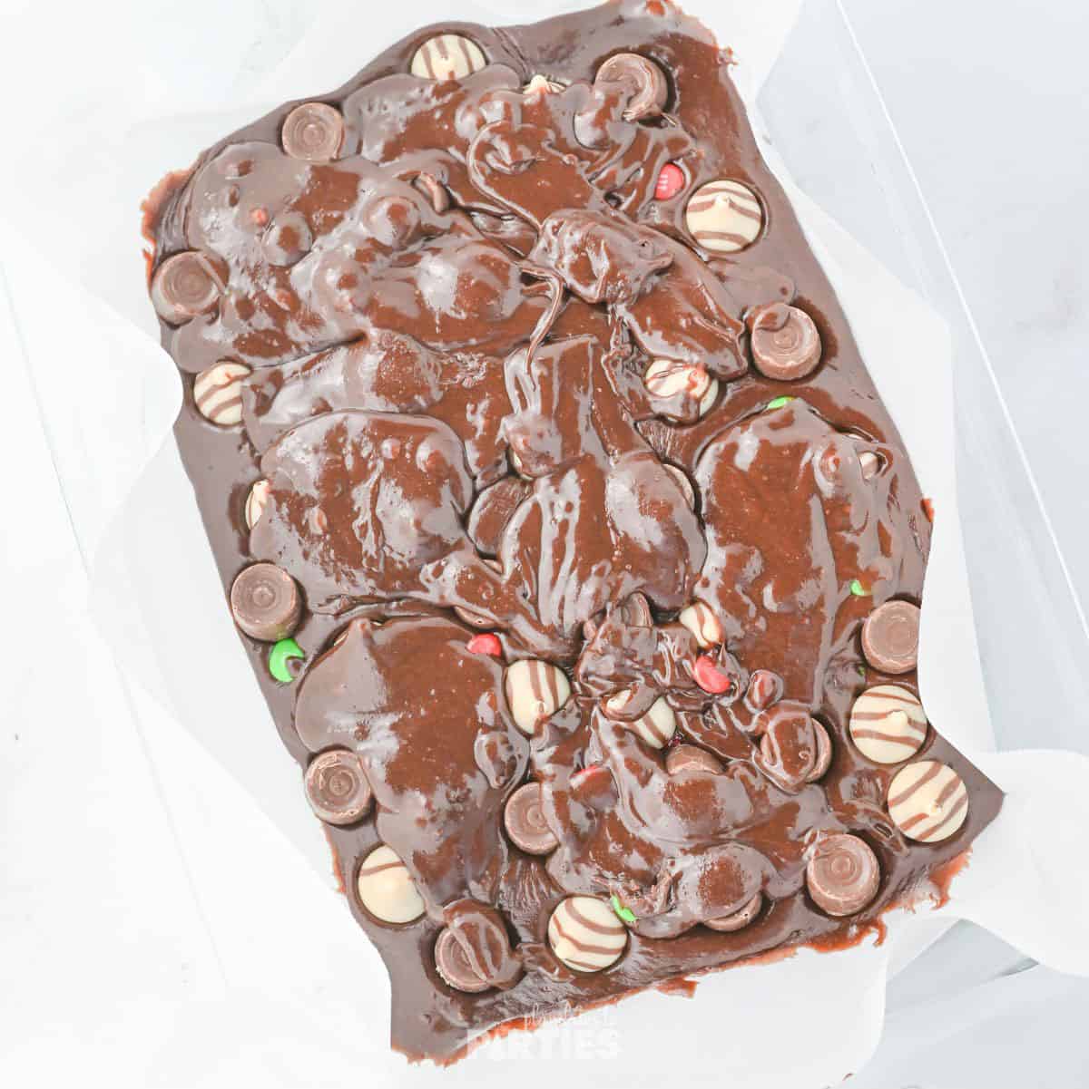 Hershey's hugs and kisses layered on the brownie mix.