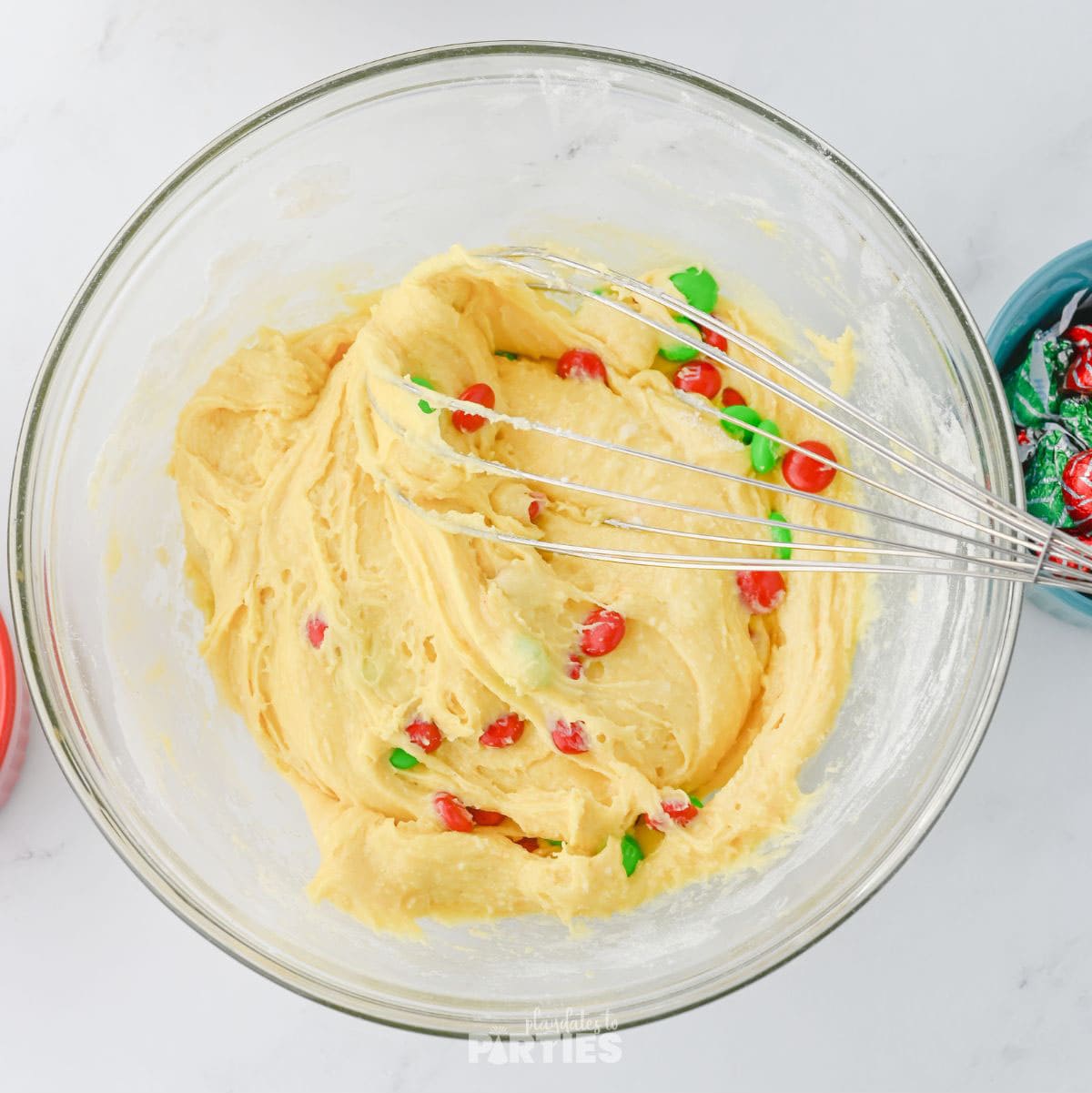 Holiday candies getting mixed into the cake mix batter.